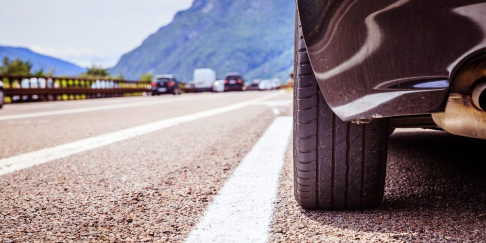 Car is standing on the breakdown lane, asphalt and tyre, Italy